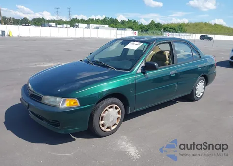 2000 Mitsubishi Mirage De z USA, uszkodzony, nr VIN JA3AY26C1YU012087